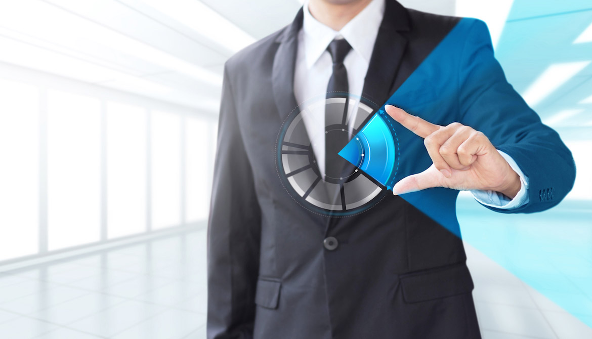 Businessman interacting with a holographic pie chart signifying market share and growth