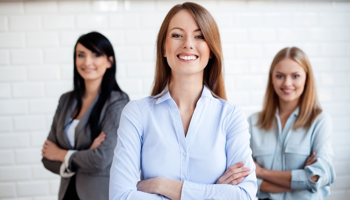 Three business women smiling