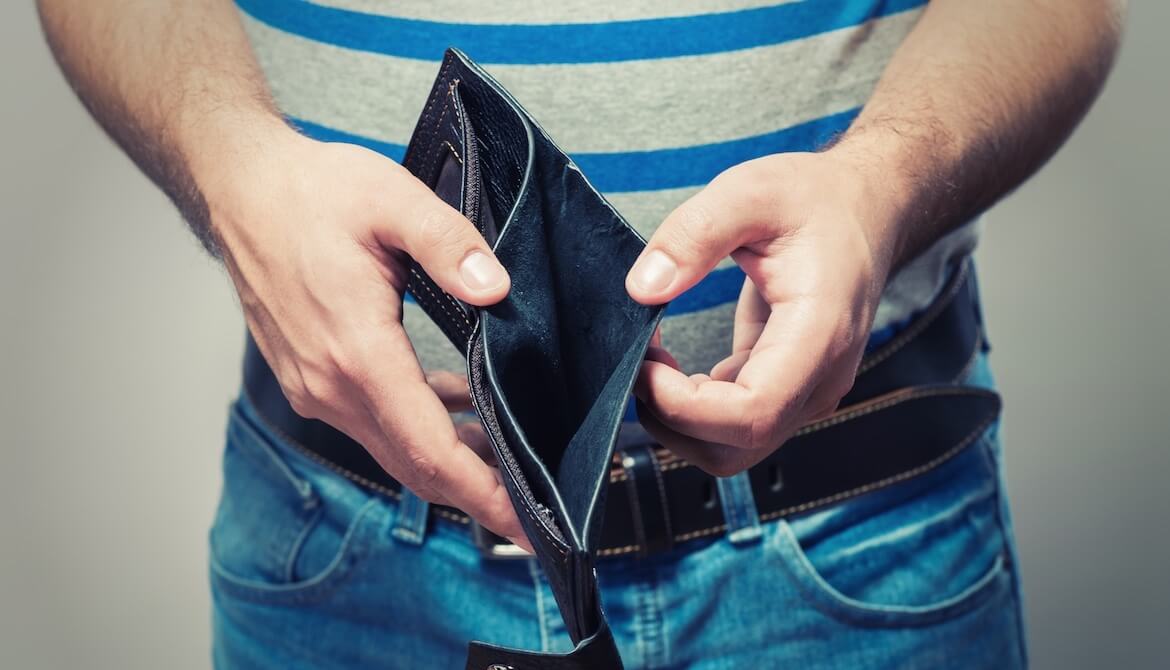 man holding open an empty wallet