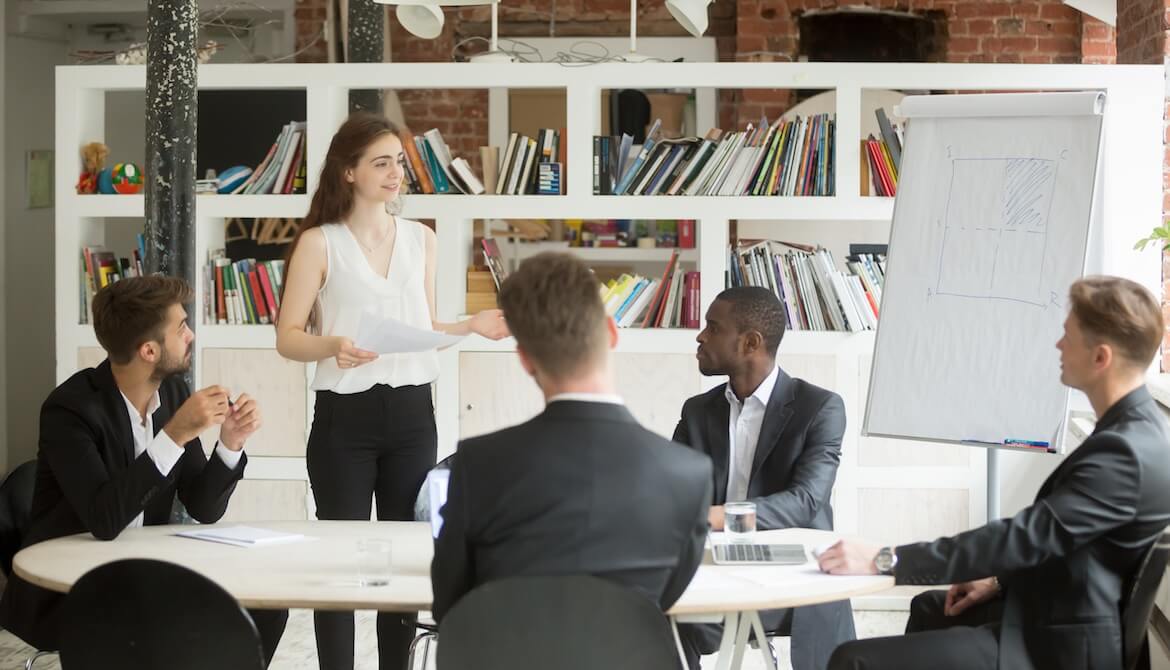 Female business manager coaching a group of employees