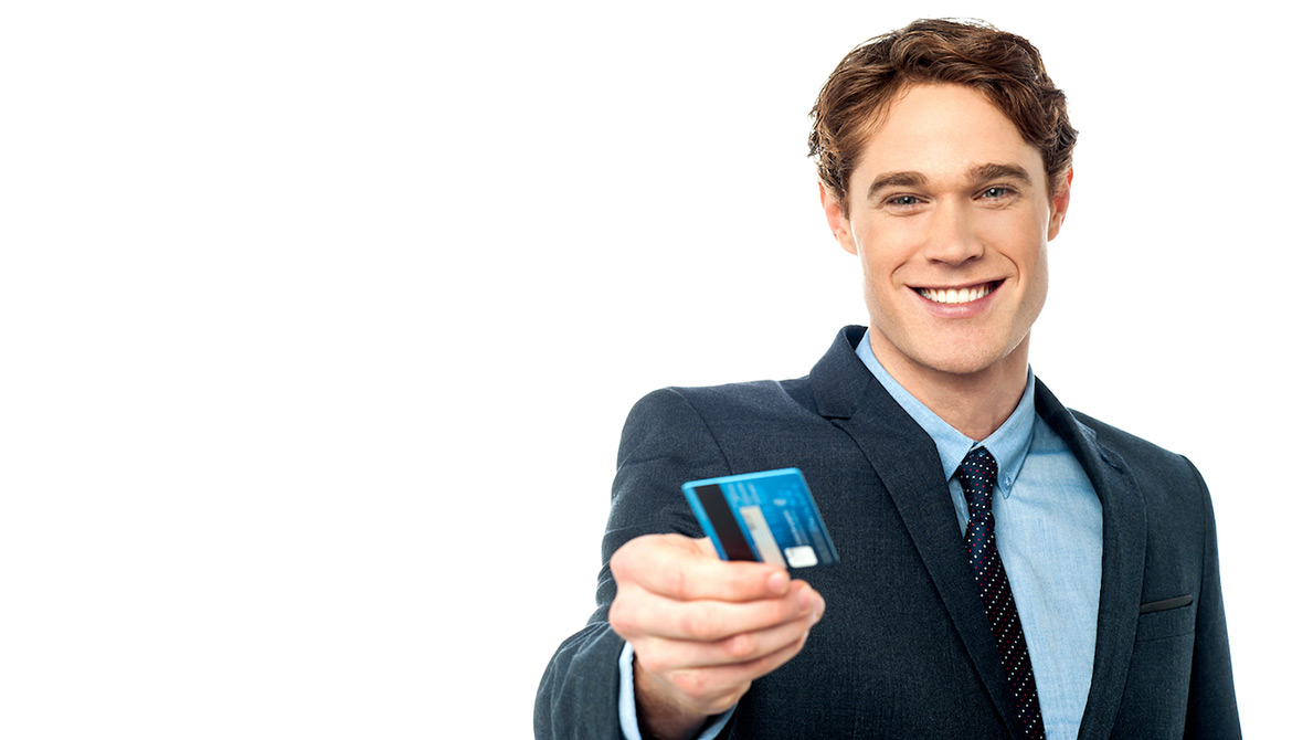 Smiling businessman handing over his debit card