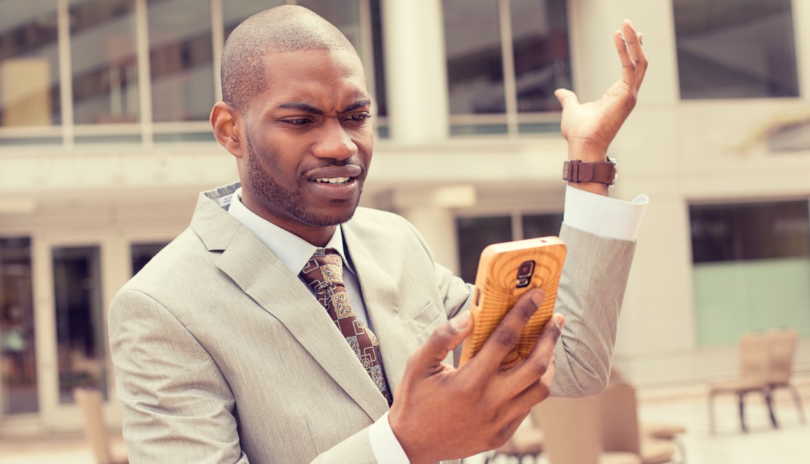 HR professional looking offended at phone