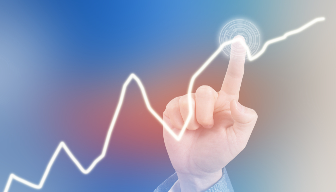 finger pointing at a bump in financial graph