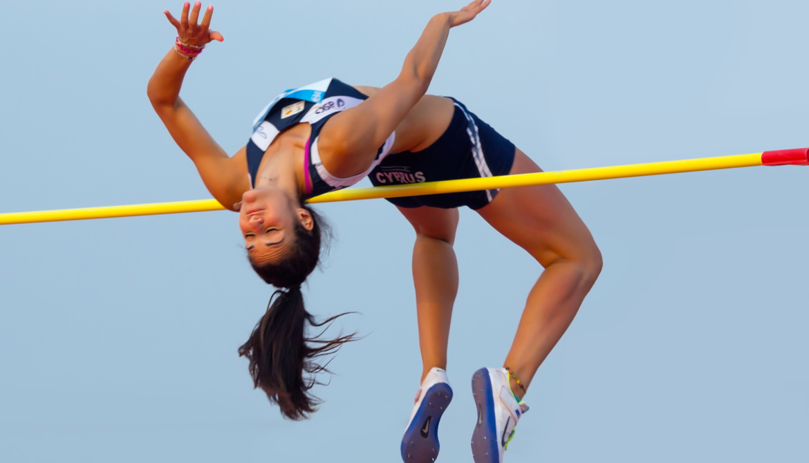 woman clears high jump