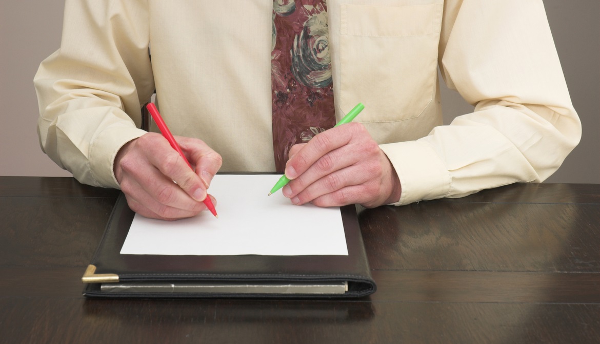 Ambidextrous Businessman working with both hands