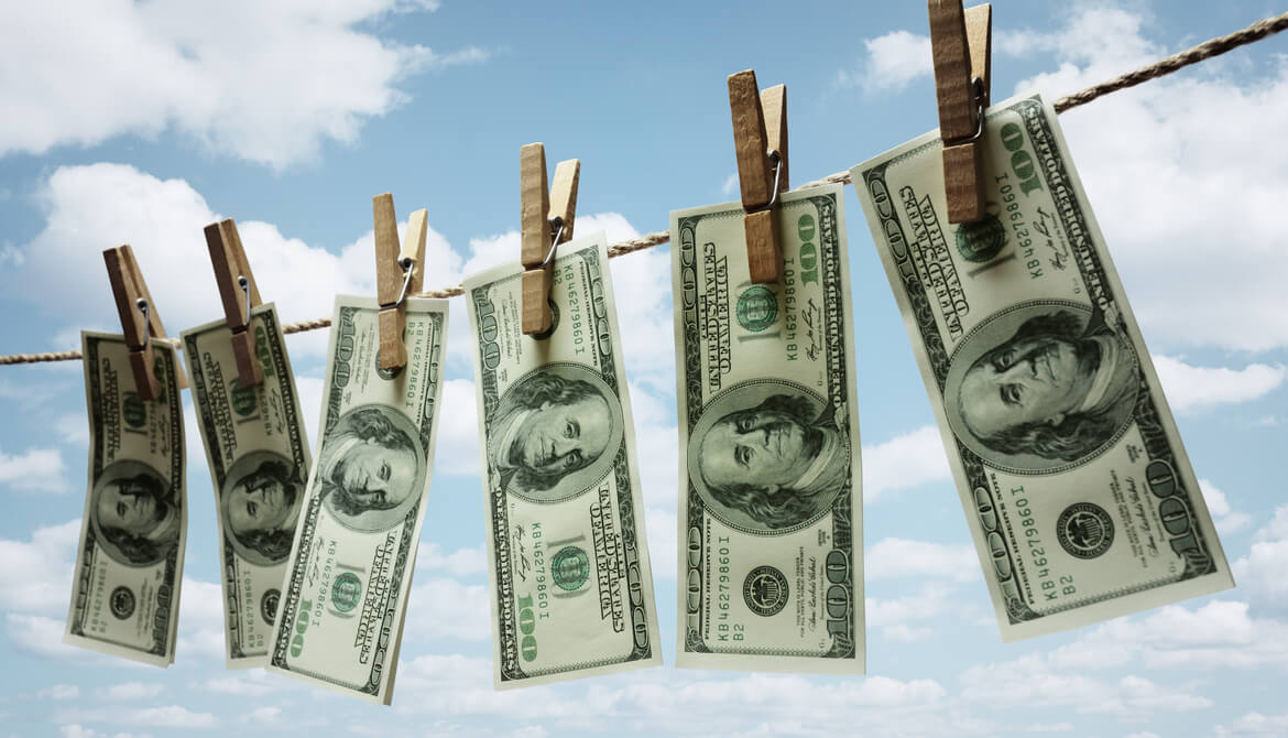 Dollar bills drying on a clothes line