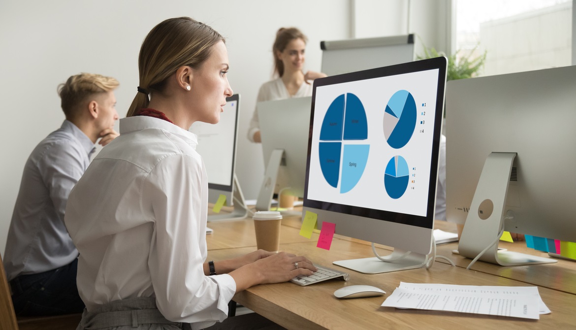 young business woman working with data on a computer