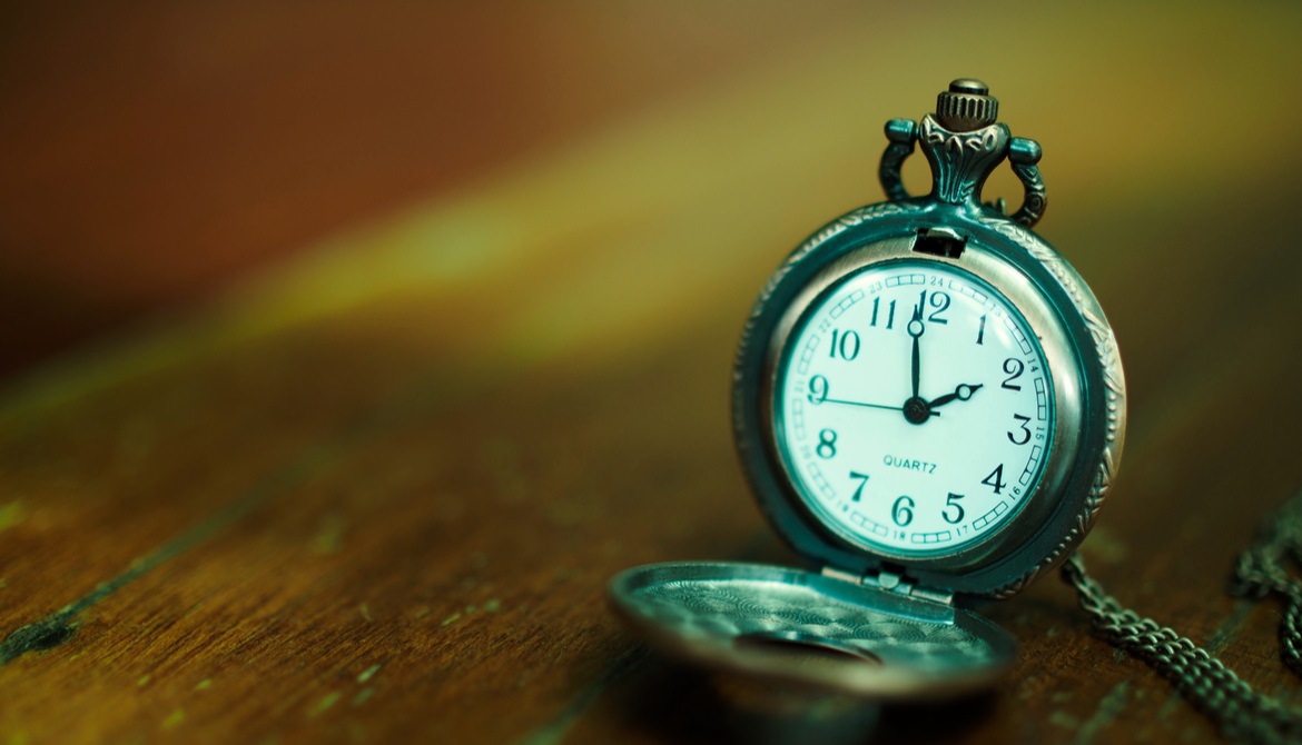 antique clock on boards