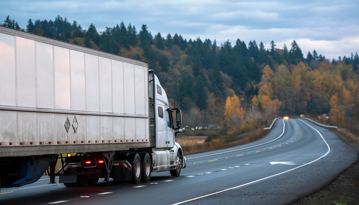 long-haul semi-truck going down the highway