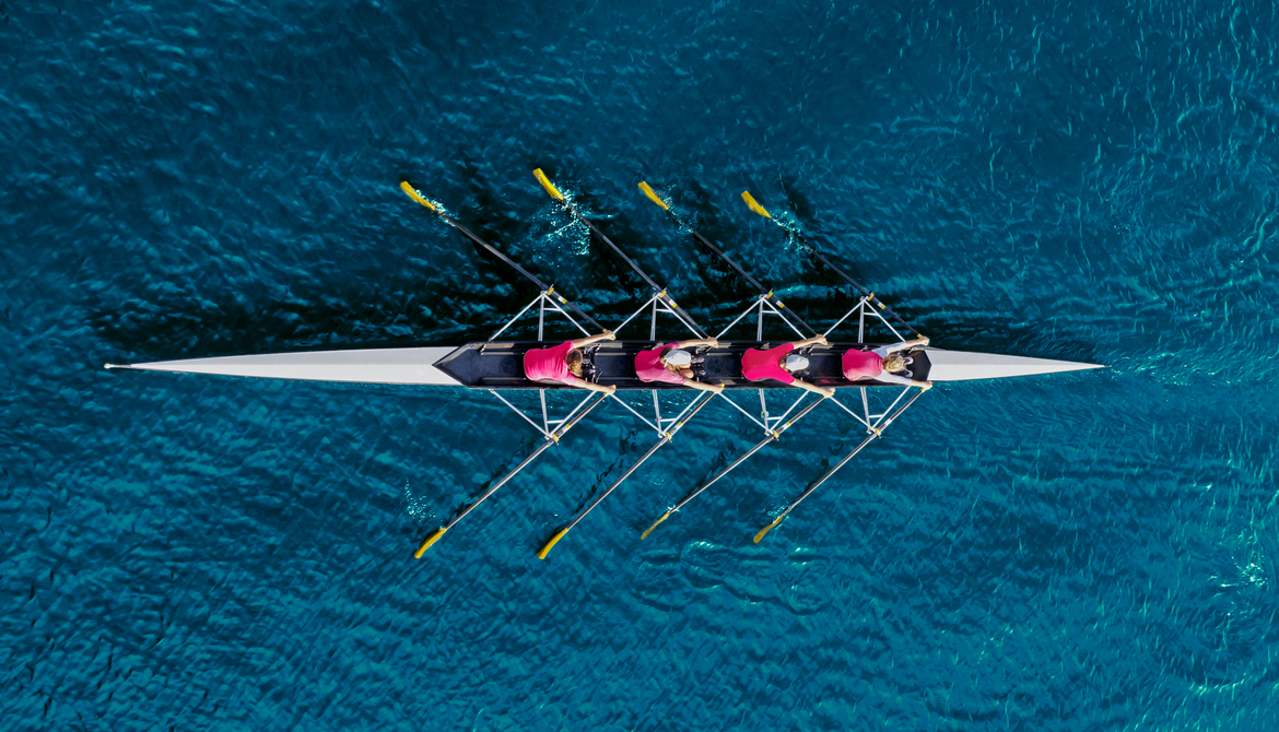 crew team rows on water