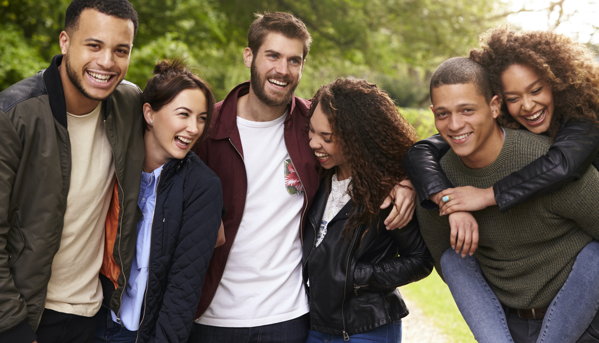 Six young adult friends having fun on a country walk