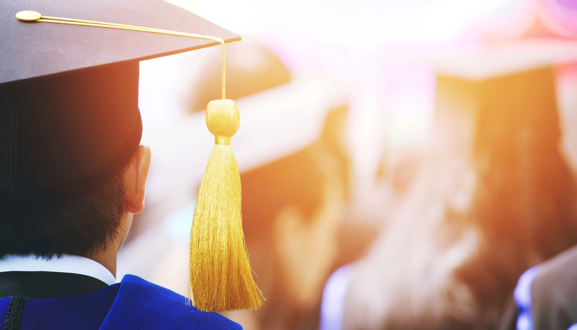 shot of graduation hats during commencement