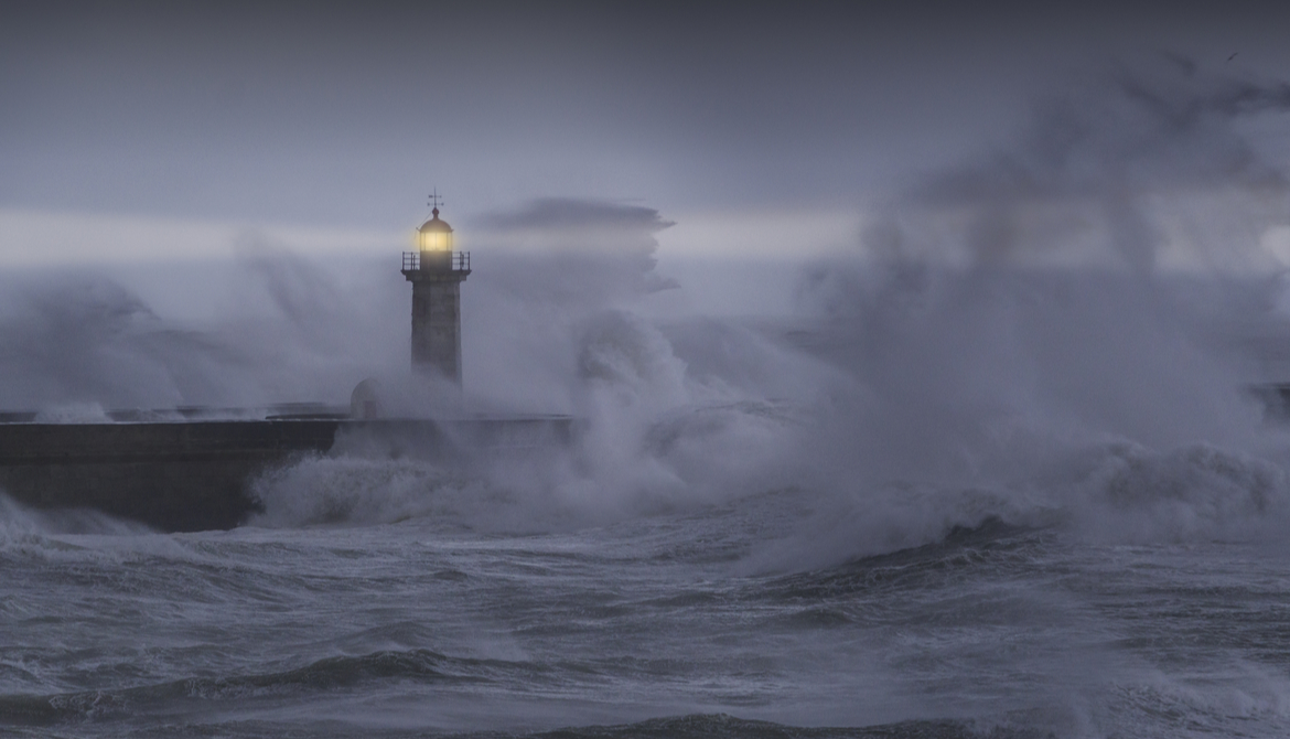 a beacon on a lighthouse in a storm