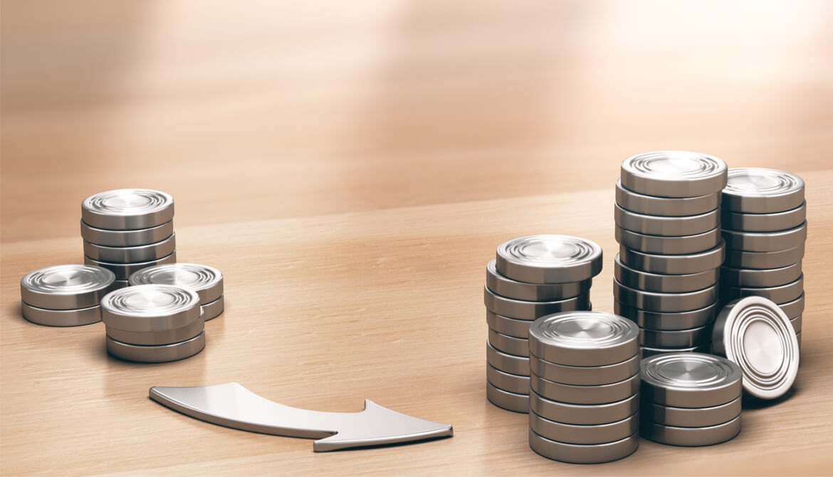 smaller pile of coins with arrow pointing to larger pile of coins