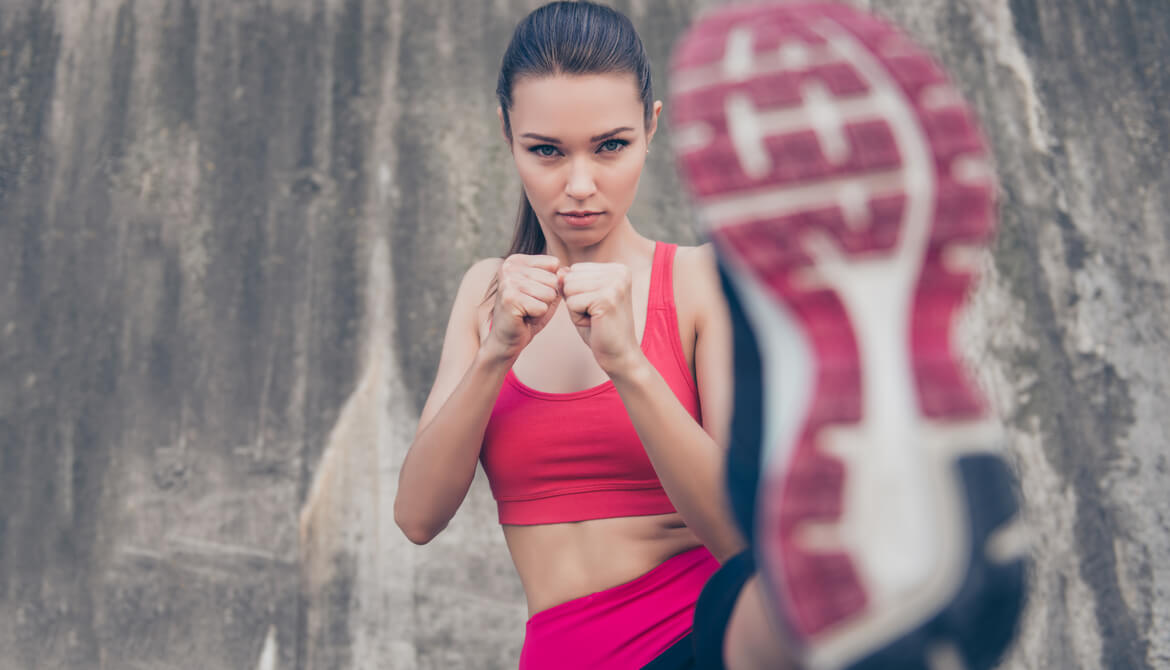 young woman kicking