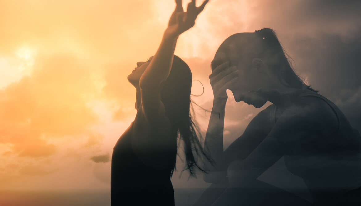 overlapping images of a young woman feeling sad and stressed sitting with head in hand and same young woman standing with arms raised in victory and happiness