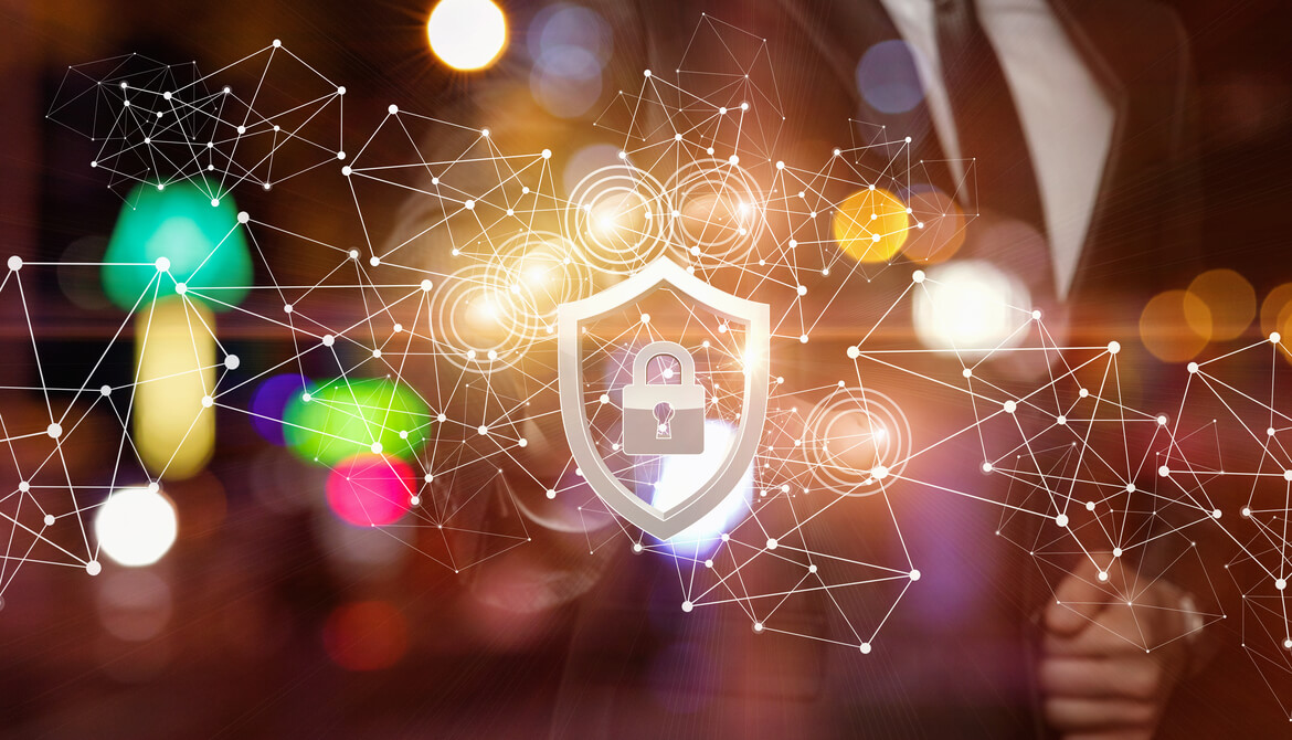 businessman in a suit behind a network of connected data points and an icon of a padlock inside a shield representing cybersecurity