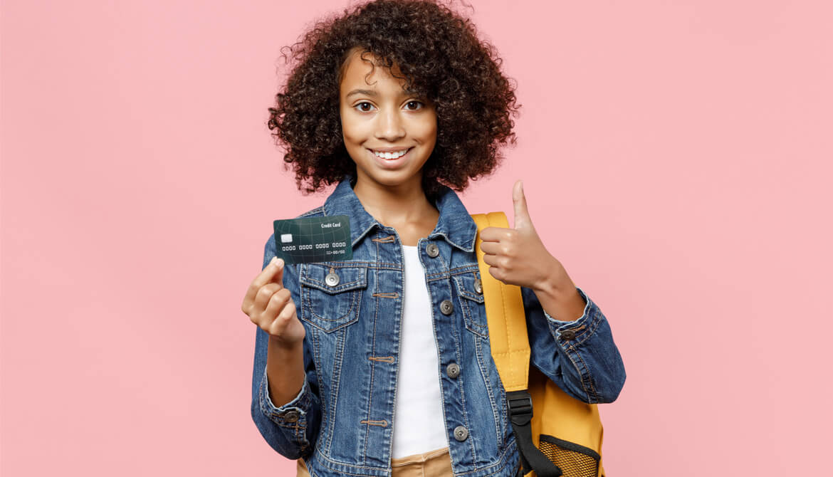 African-American kid with backpack and credit card