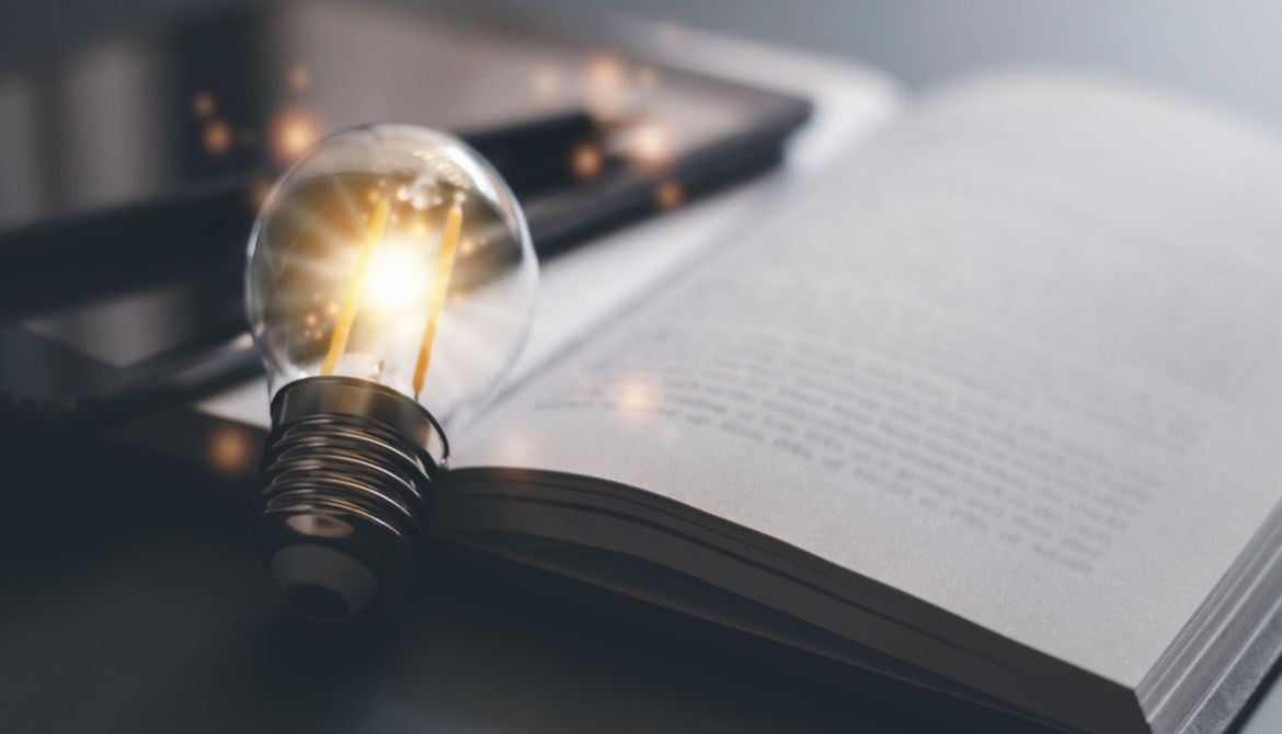 bright light bulb on a book