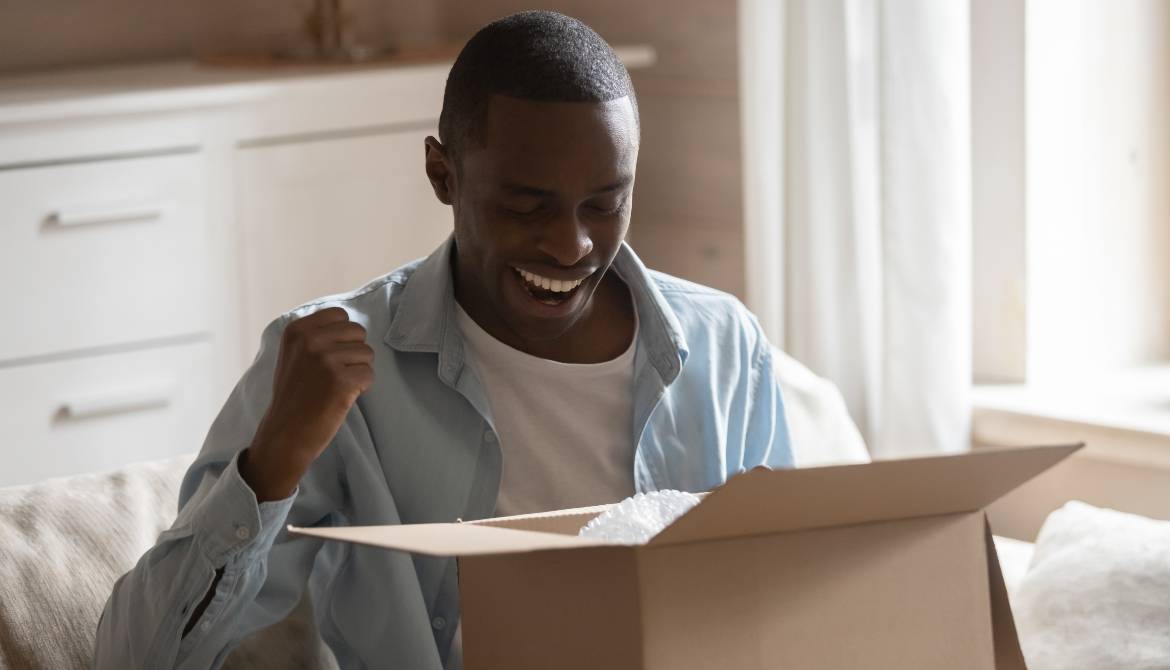 man excited about box delivery