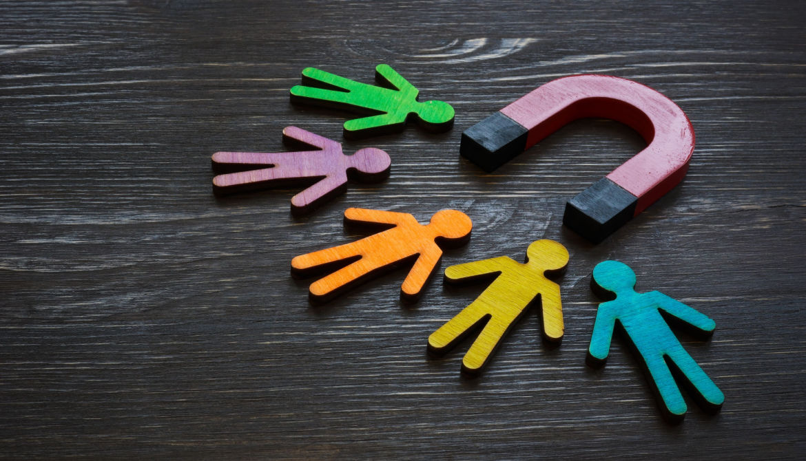 magnet attracting colorful cutouts of people