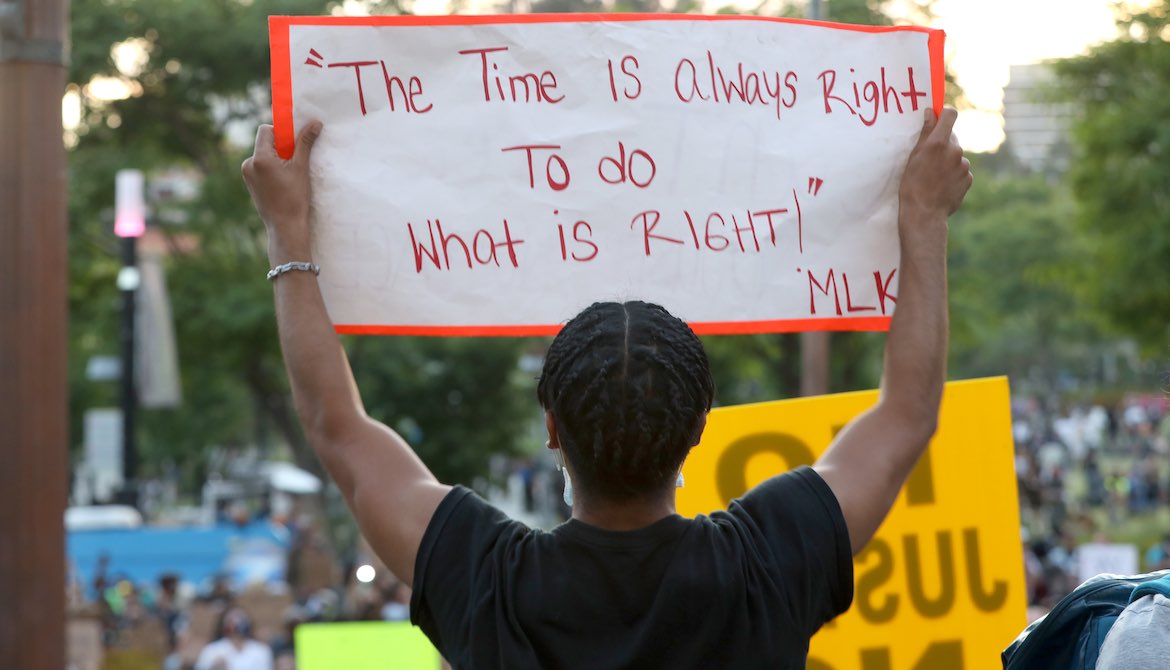 Martin Luther King Jr. quote on poster during protest