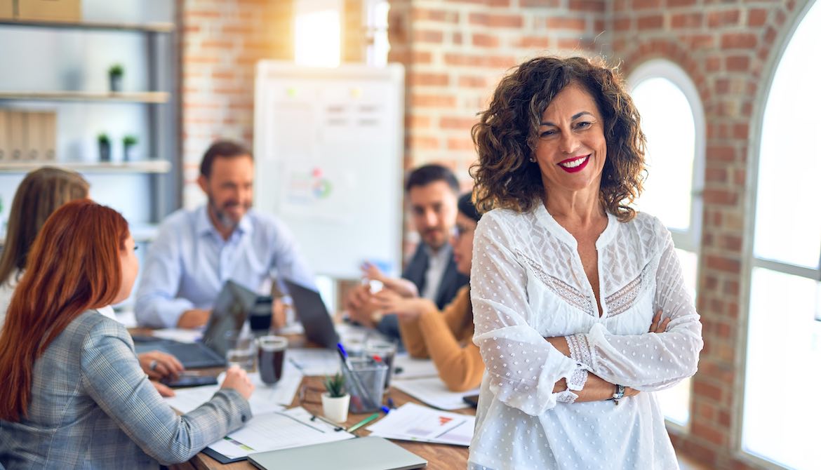 mature leader at meeting table