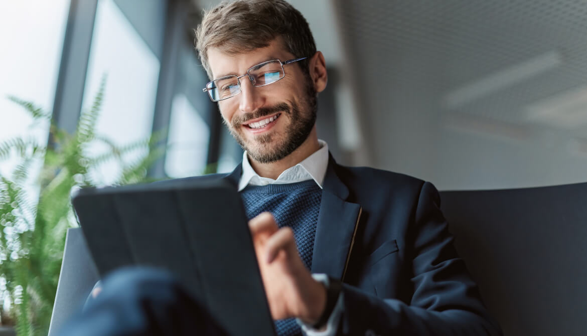 man working on his tablet