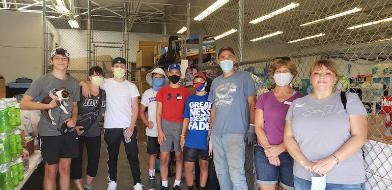 Trish Kron and volunteers after the Iowa derecho storm