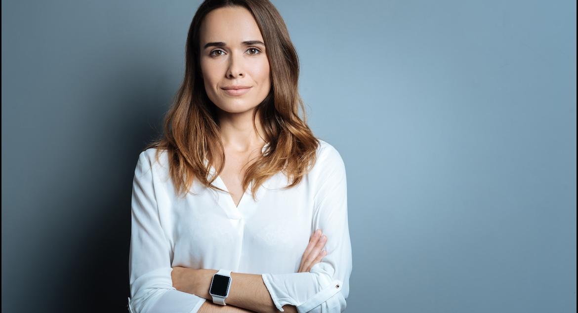 ready female executive crossing arms