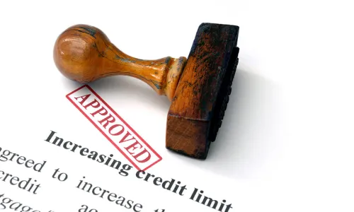 Approved stamp lying on a letter notifying of increased credit limit