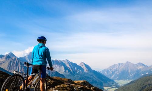 biker views a beautiful mountain vista