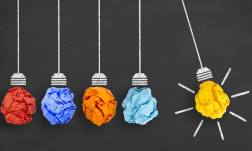 line of paper light bulb suggesting innovation