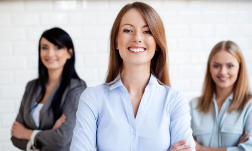 Three business women smiling