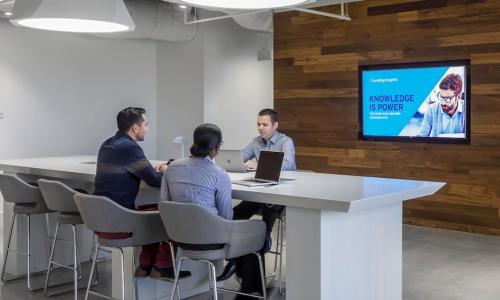 CU Direct regularly hosts CU and industry leaders at its Innovation Lab to collaborate on mapping and developing new solutions that improve lending and member engagement. CU Direct SVP/Marketing and Innovation Brian Hendricks (facing camera) meets with two other members of the CU Direct team.