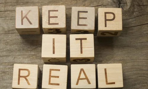 KEEP IT REAL spelled out on wooden blocks