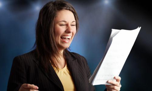 Girl singing a song with notes in her hand