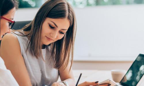 one business woman helping another