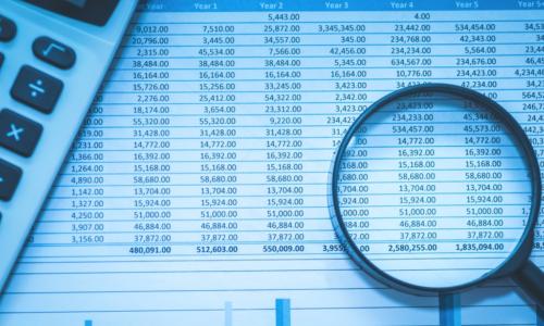 Spreadsheet bank accounts accounting with calculator and magnifying glass. 