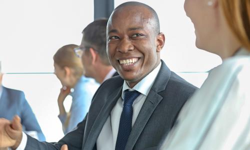 african american board member talks with another director