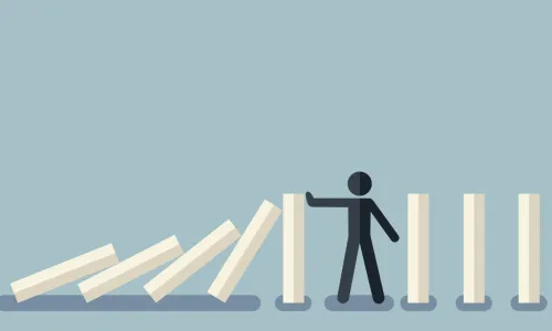 illustration of man stopping dominoes from toppling