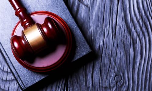 gavel on blue wooden background