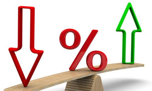 Red percent sign and arrows on a scale in the equilibrium position for financial concept