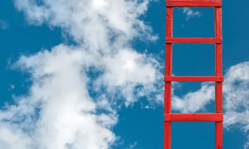 red ladder climbing into the clouds