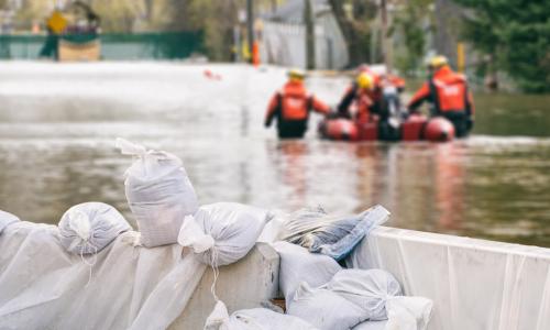 sand bags and flood rescue personnel