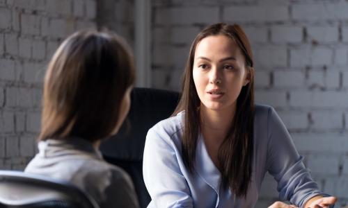 young female financial advisor counseling credit union member