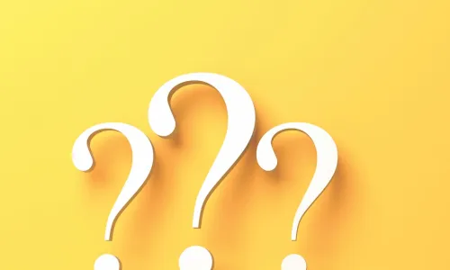 Three yellow question marks on a yellow background 