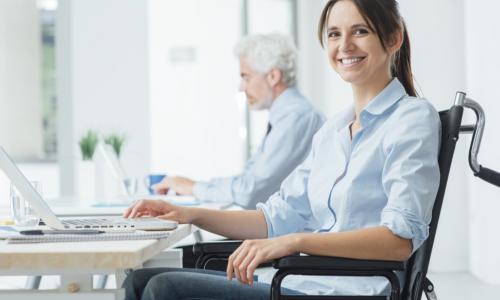 confident female employee using a wheelchair