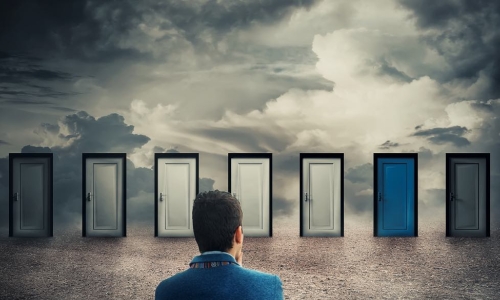 executive chooses from a line up of doors
