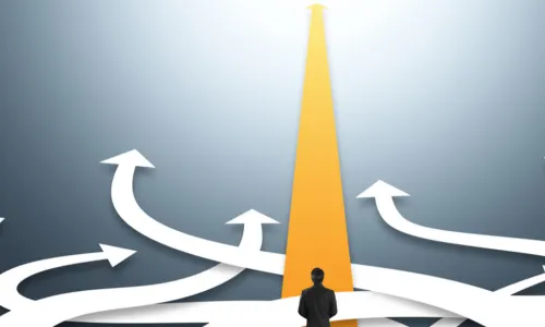 executive choosing a straight yellow pathway over curving ones